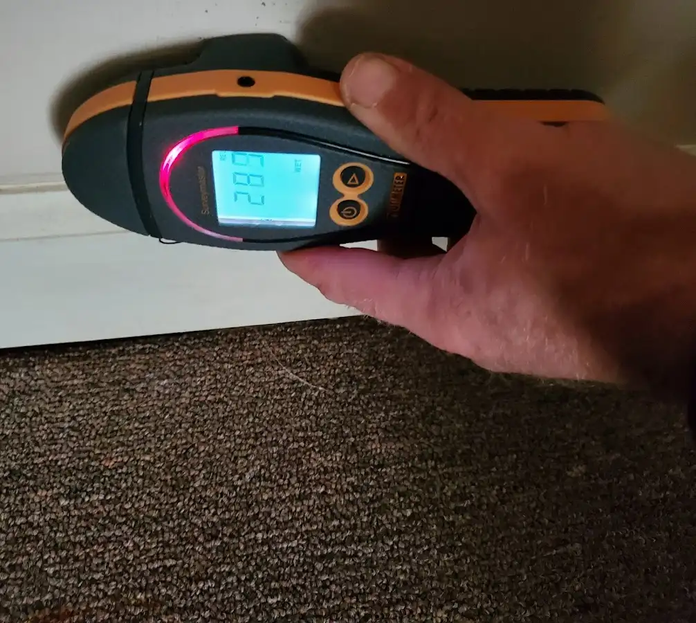 Moisture detection at baseboard during Storm Damage Restoration in Gloucester
